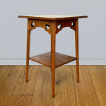 A near pair of oak occasional tables attributed to Liberty & Co.